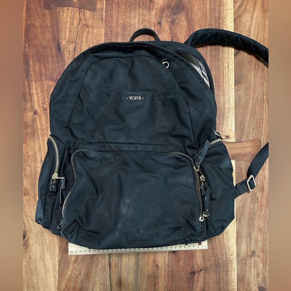 Tumi Travel Back pack cream interior with gold accents